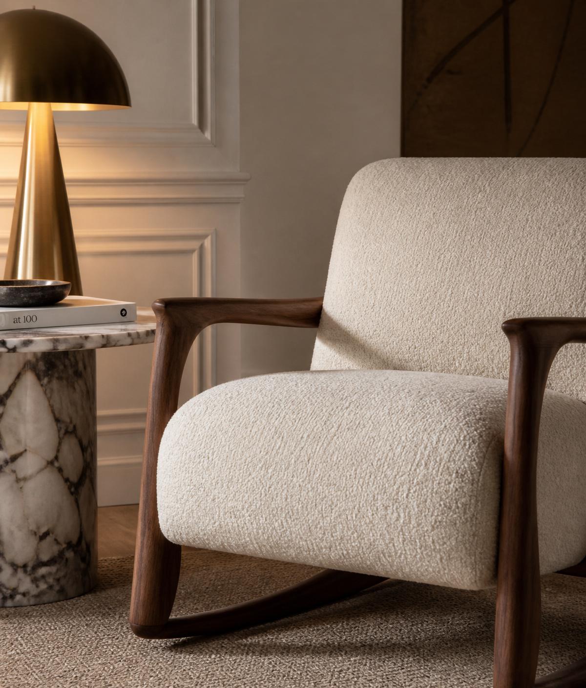 Boucle armchair with marble side table and brass lamp